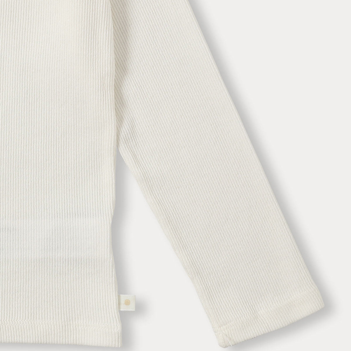 Ribbed Ruffle Top	| Ivory